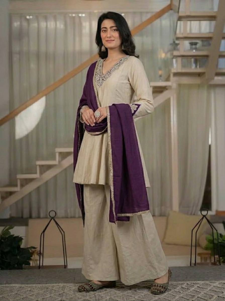 Regal Cream Silk Peplum Kurti and Flared Palazzo Suit Set Adorned with Ornate V-Neck Embroidery and a Rich Plum Purple Dupatta